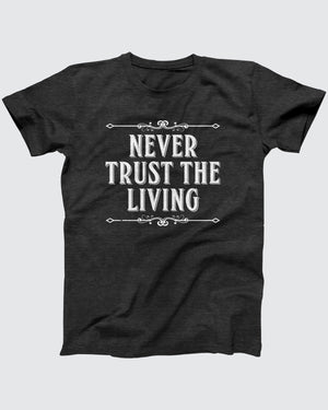 Never Trust the Living T-Shirt, flat lay on grey