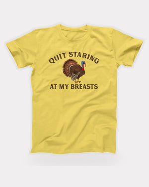 Quit Staring At My Breasts T-Shirt in Maize Yellow, flat lay on grey