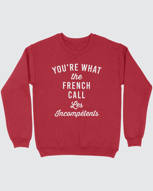 Les Incompétents Ugly Sweater, flat lay on grey