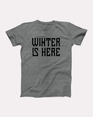 Winter is Here T-Shirt, flat lay on grey