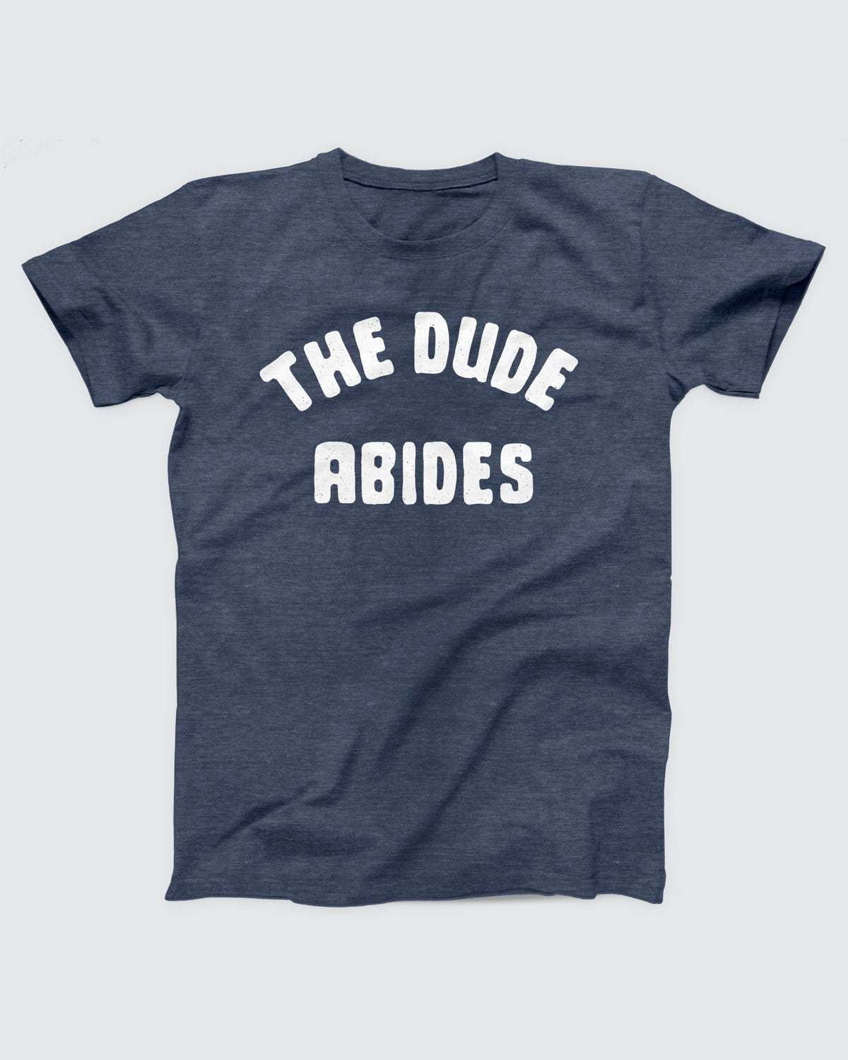The Dude Abides T-Shirt, flat lay on grey