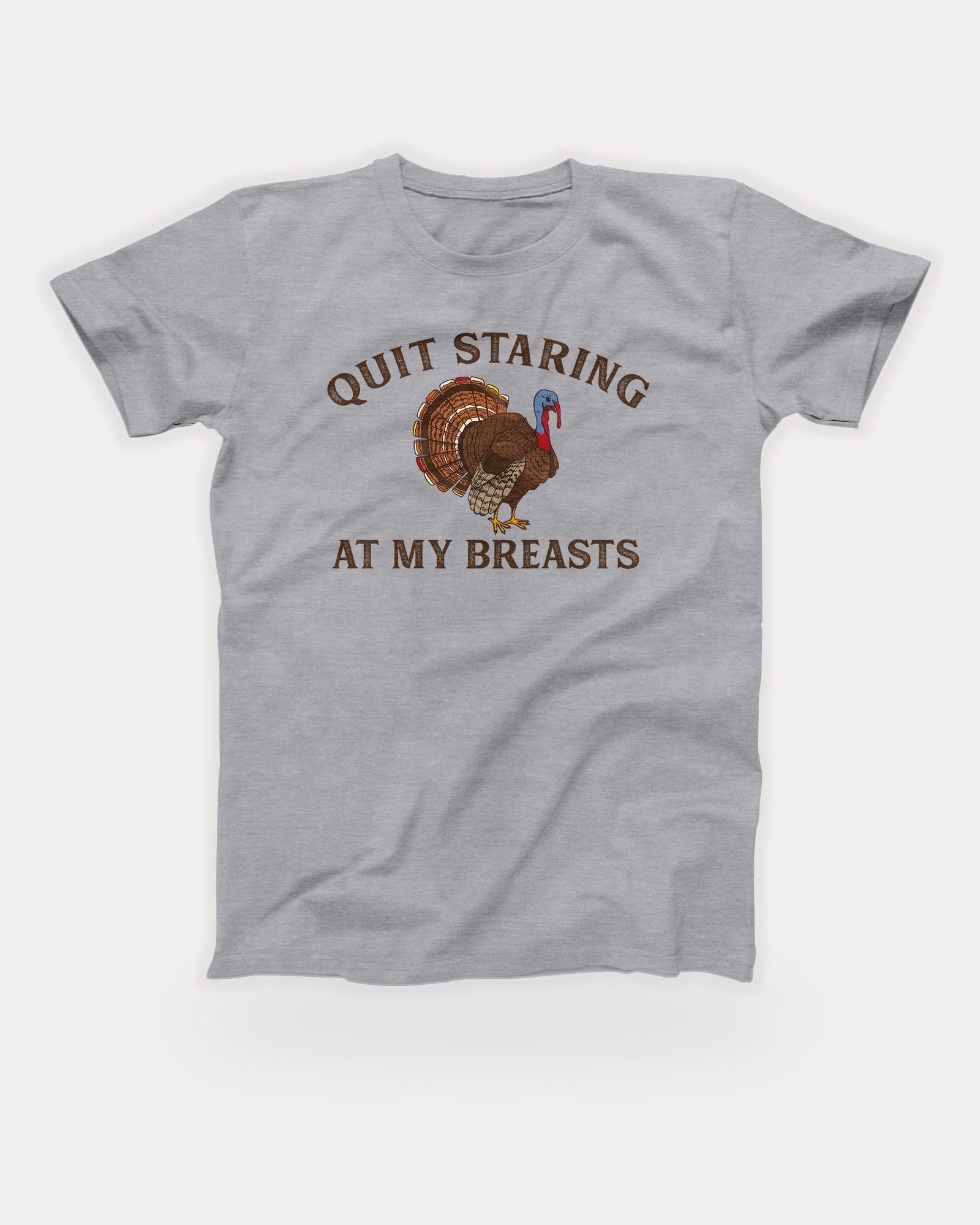 Quit Staring At My Breasts T-Shirt in Athletic Heather, flat lay on grey