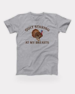 Quit Staring At My Breasts T-Shirt in Athletic Heather, flat lay on grey