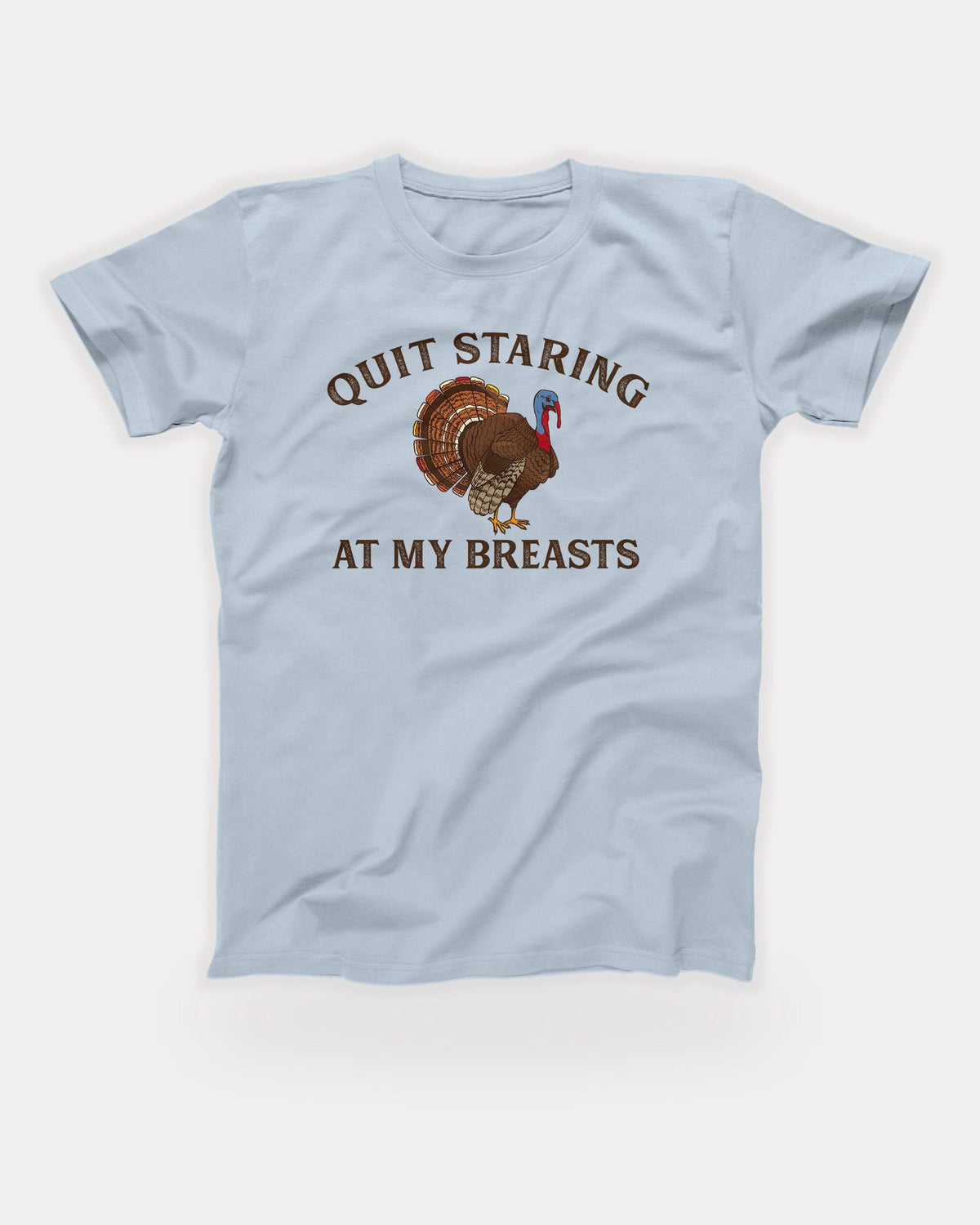 Quit Staring At My Breasts T-Shirt in Light Blue, flat lay on grey