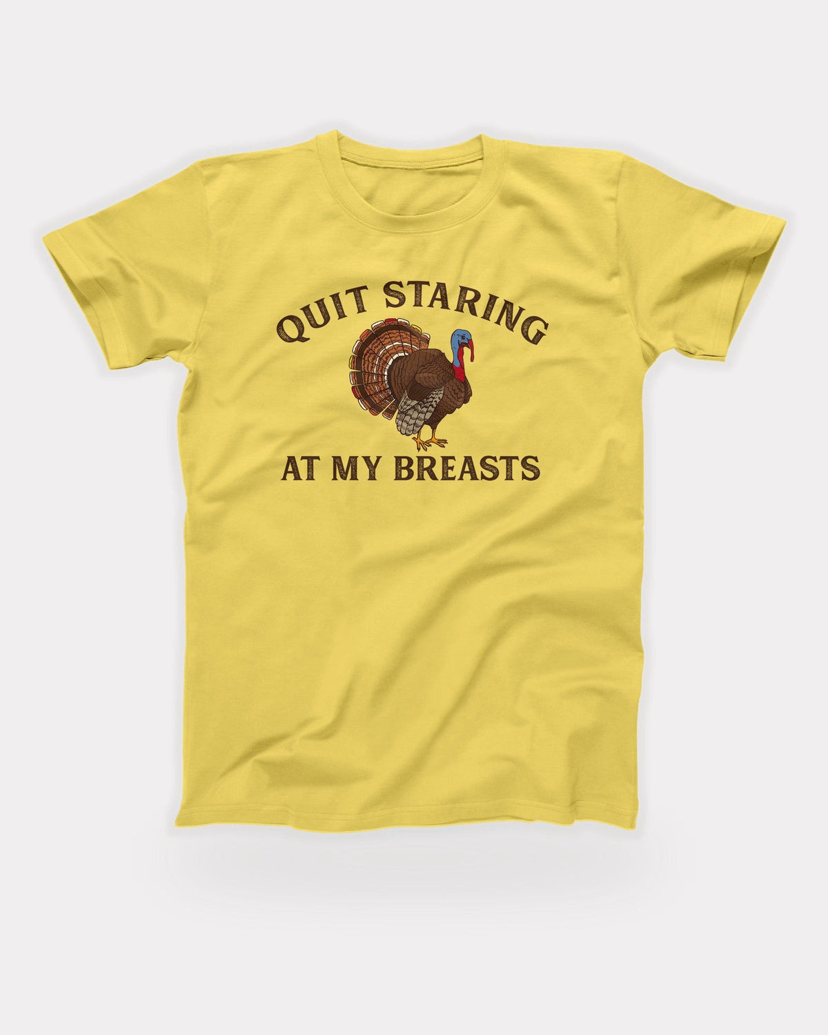 Quit Staring At My Breasts T-Shirt in Maize Yellow, flat lay on grey