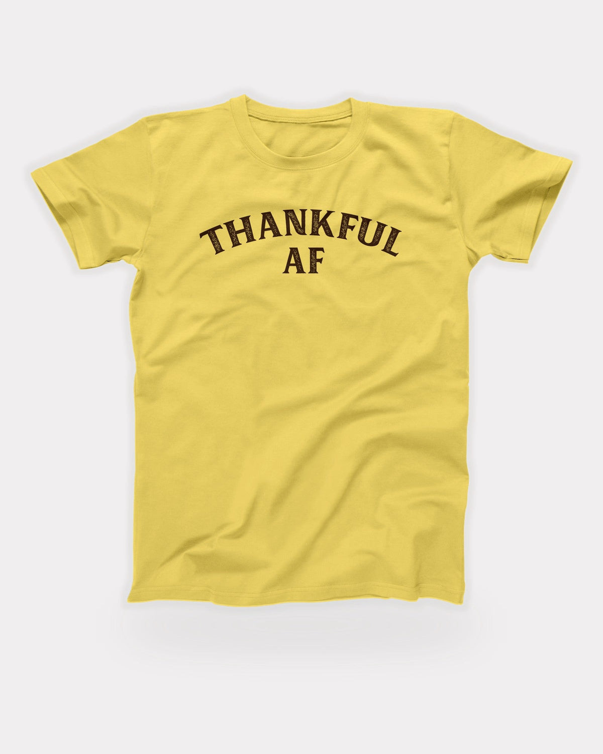 Thankful AF T-Shirt in Maize Yellow, flat lay on grey