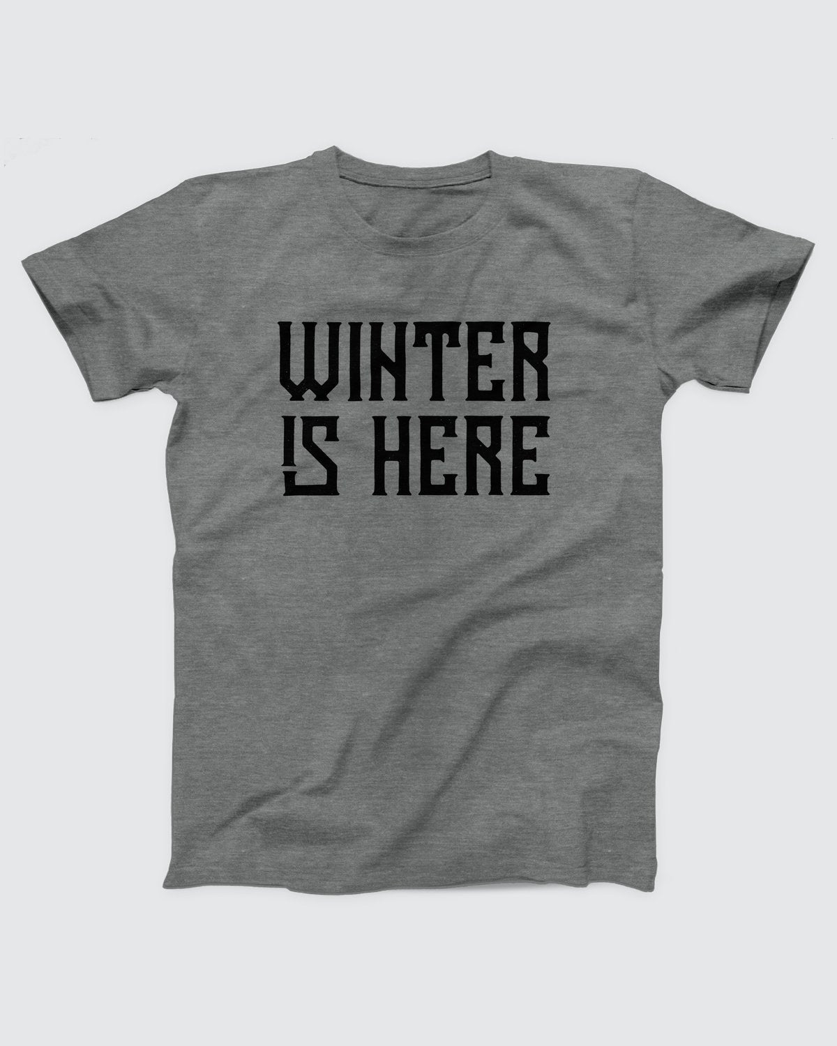 Winter is Here T-Shirt, flat lay on grey